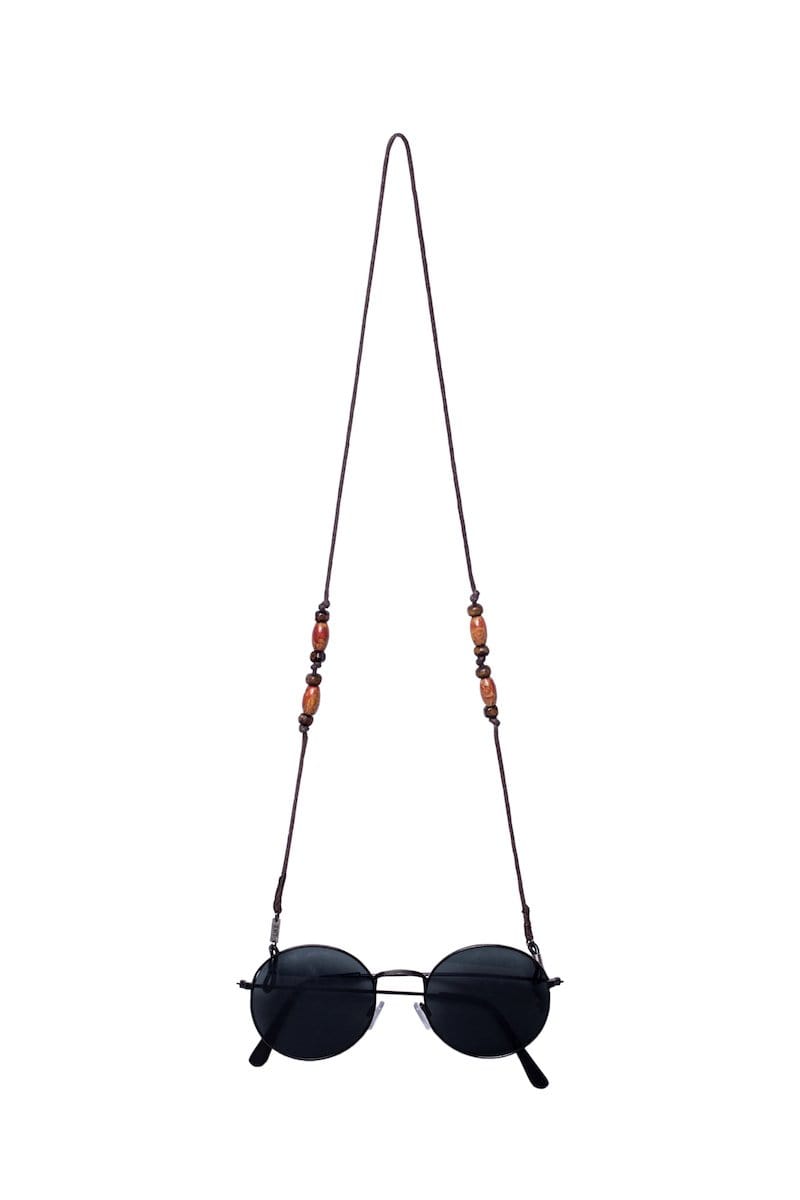 Glasses strap made with brown string and wooden beads.